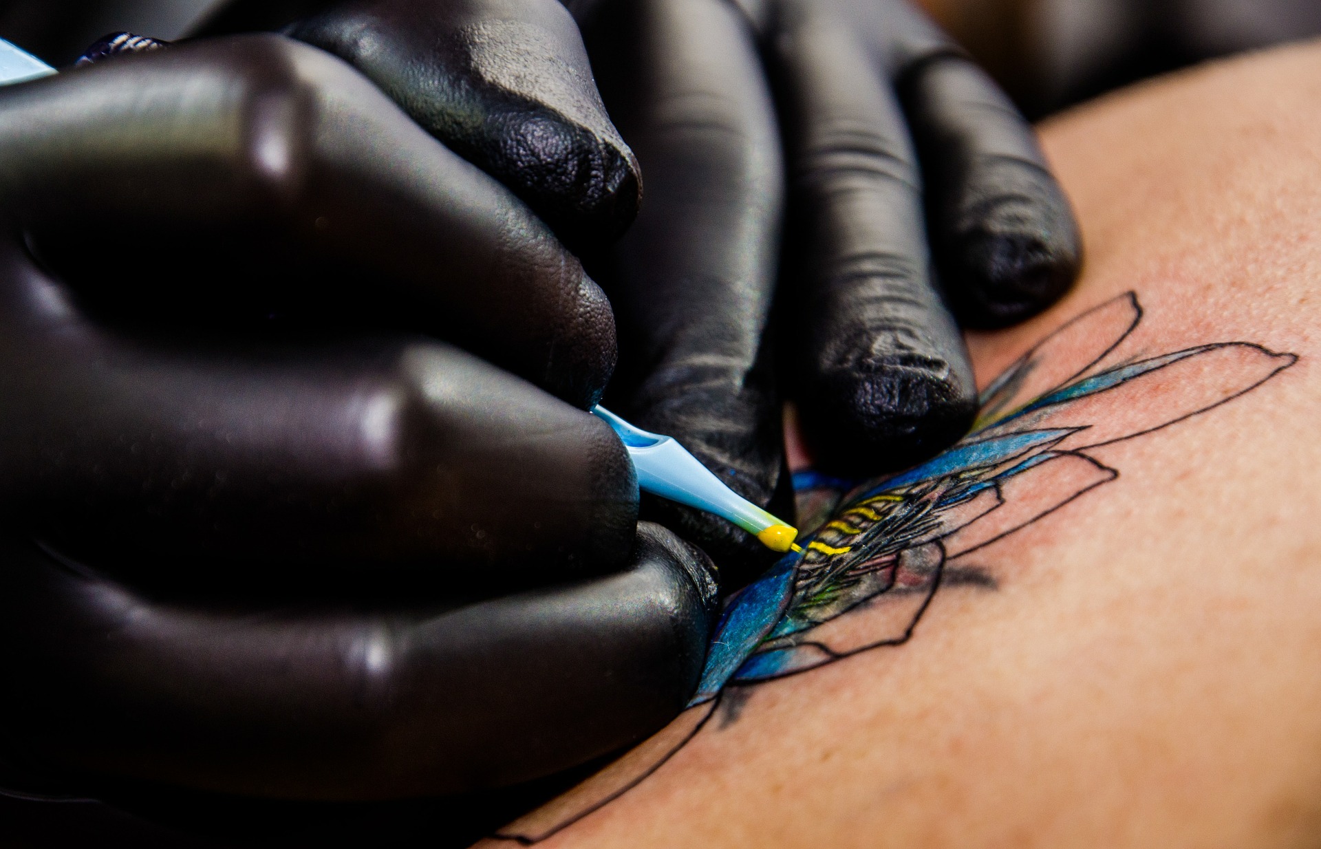Professional tattoo artist at work
